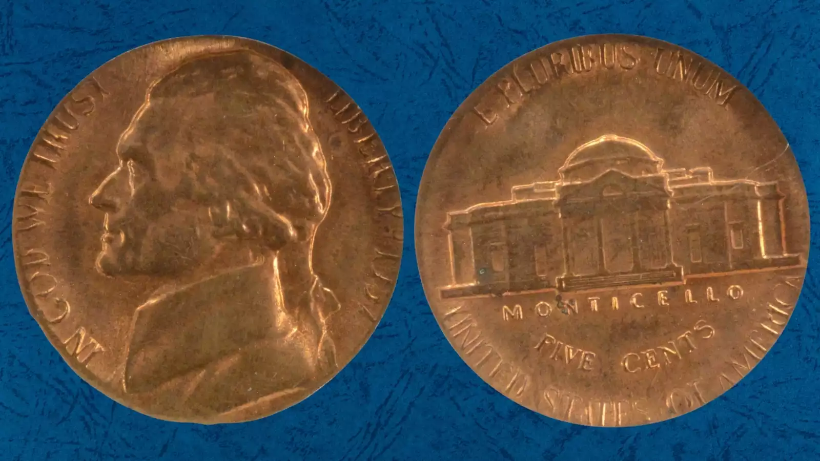 1957 nickel struck on a cent planchet showing undersized copper coin with truncated nickel design beside a normal 1957 nickel for comparison